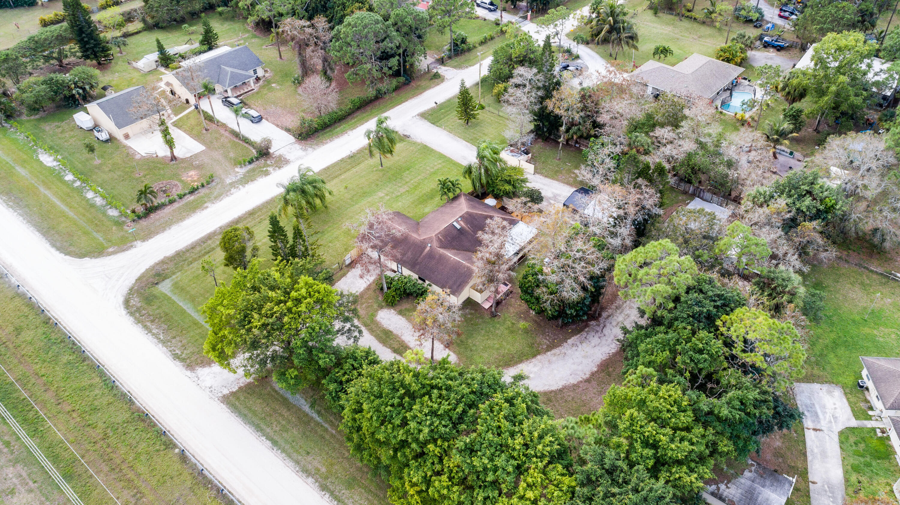 16887 West Cornwall Drive Loxahatchee, FL 33470 - Photo 35 of 37 an aerial view of residential houses with outdoor space