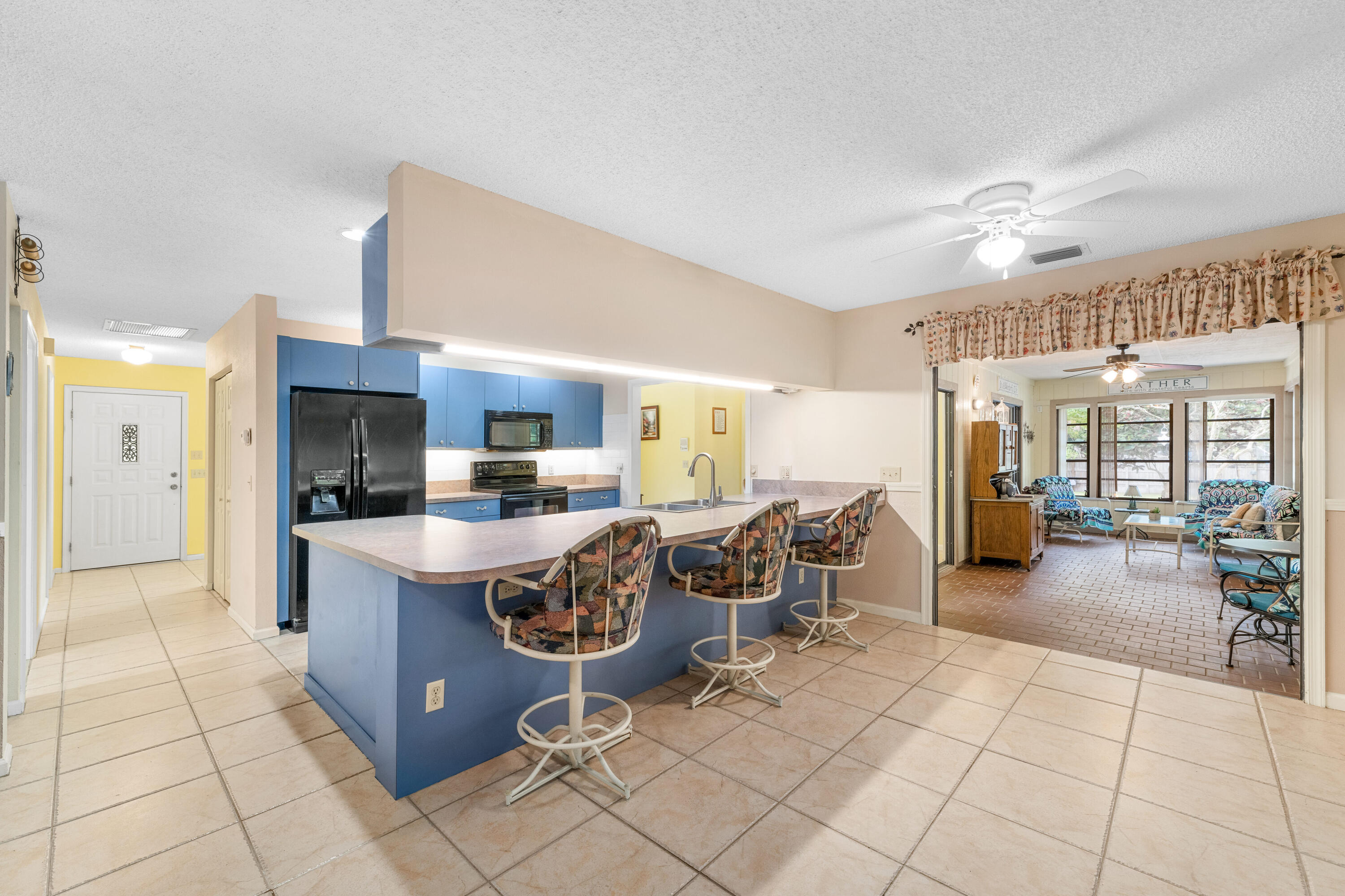 16887 West Cornwall Drive Loxahatchee, FL 33470 - Photo 4 of 37 a living room with furniture a dining table and chairs