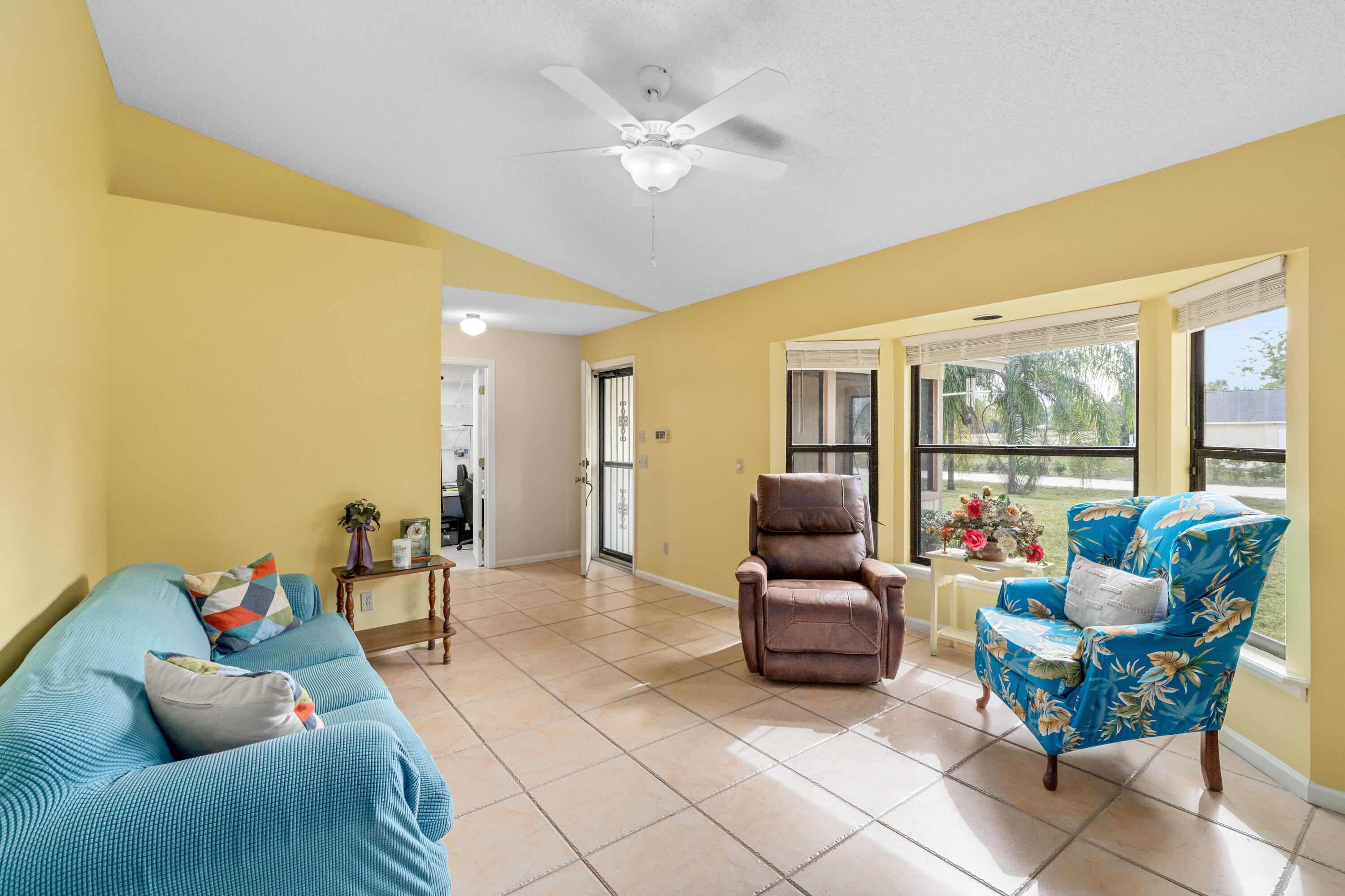 16887 West Cornwall Drive Loxahatchee, FL 33470 - Photo 5 of 37 a living room with furniture and a large window