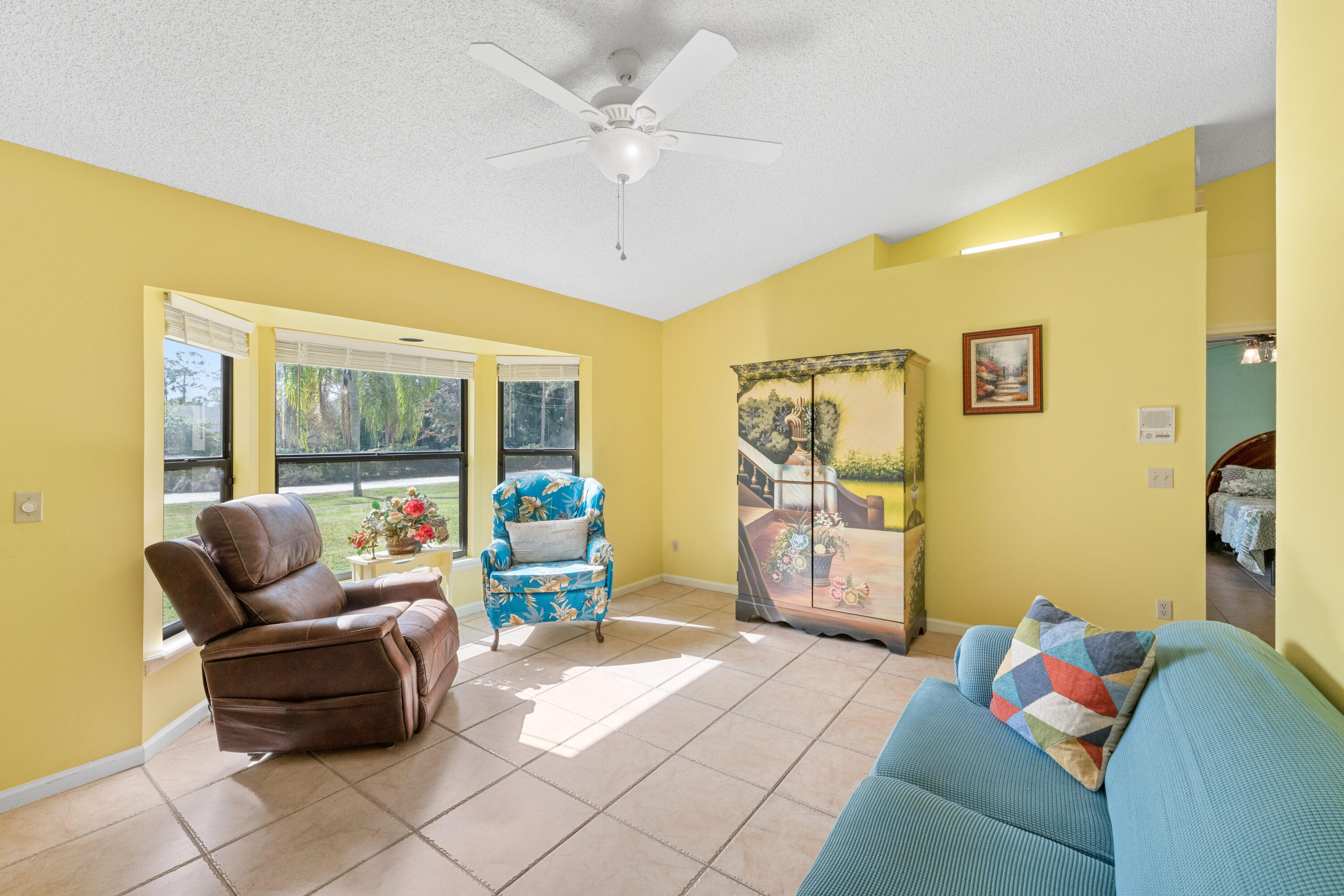 16887 West Cornwall Drive Loxahatchee, FL 33470 - Photo 6 of 37 a living room with furniture and a flat screen tv