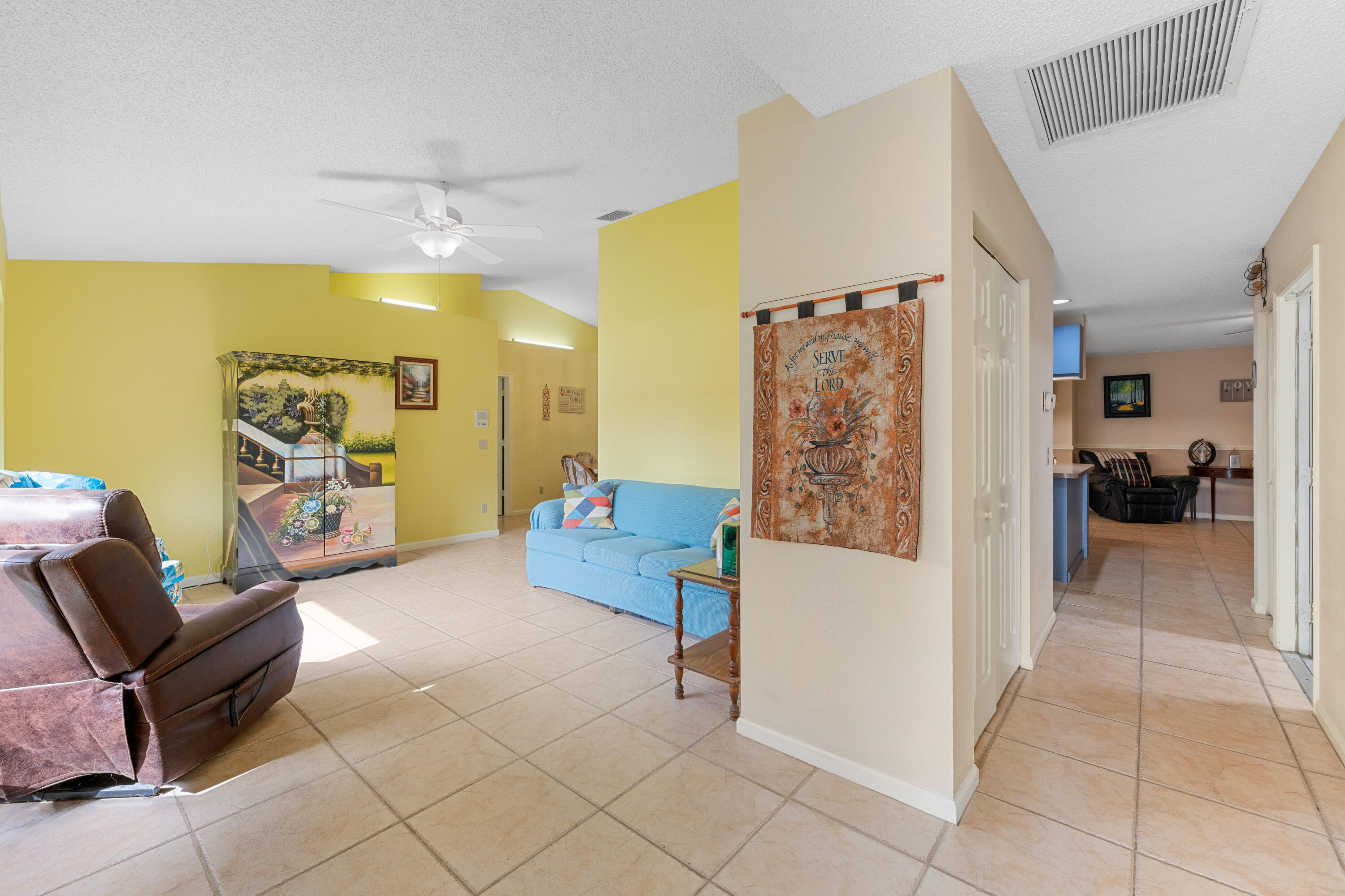 16887 West Cornwall Drive Loxahatchee, FL 33470 - Photo 7 of 37 a living room with furniture and a baby crib
