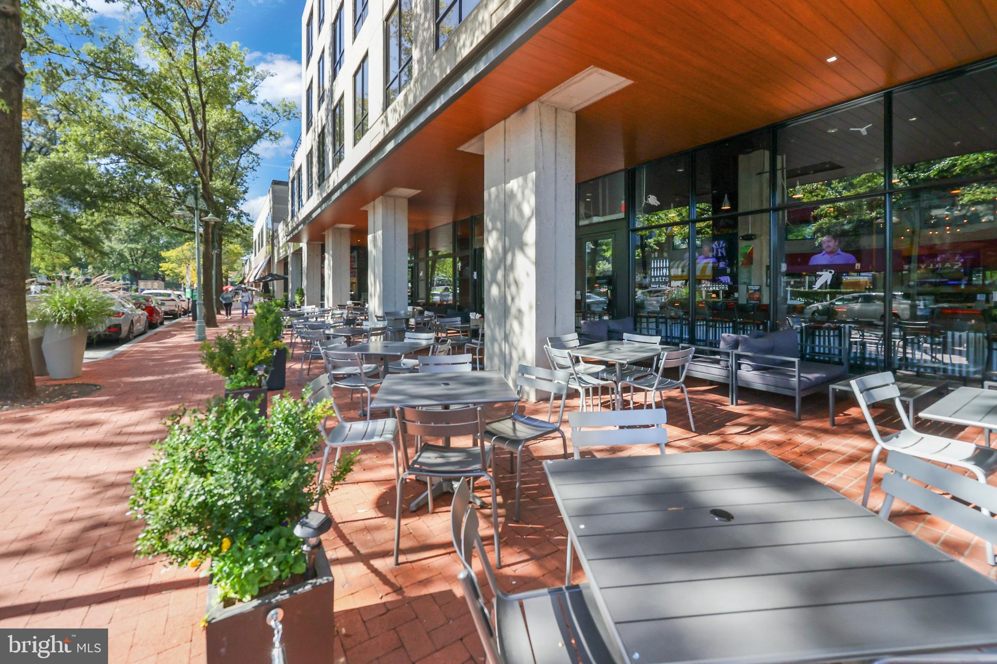 3519 Valley Drive Alexandria, VA 22302 - Photo 30 of 54 a view of a patio with table and chairs potted plants and large tree