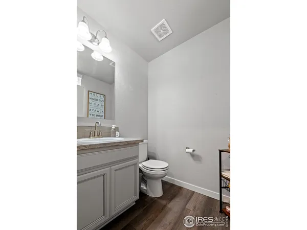 a view of a hallway with white walls