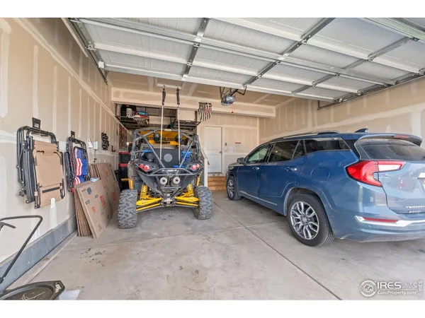 a building outdoor space with patio furniture and potted plants