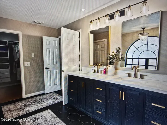 a bathroom with a double vanity sink and a mirror