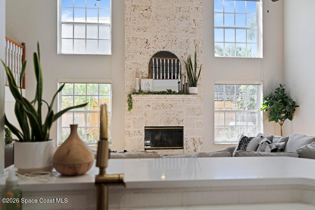 2639 Lowell Circle Melbourne, FL 32935 - Photo 11 of 45 a living room with furniture and a fireplace