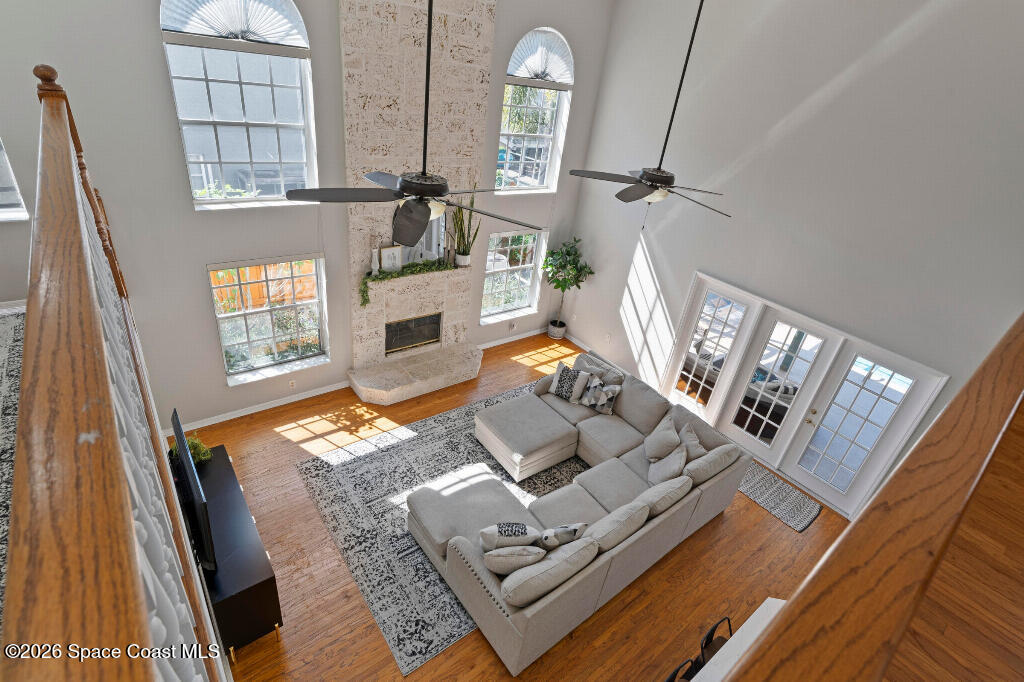 2639 Lowell Circle Melbourne, FL 32935 - Photo 27 of 45 a living room with furniture and a fireplace