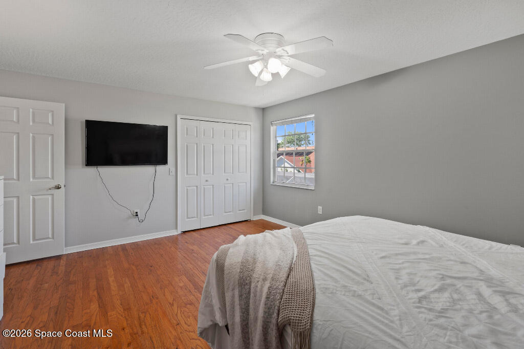 2639 Lowell Circle Melbourne, FL 32935 - Photo 33 of 45 a bedroom with a bed and a flat screen tv