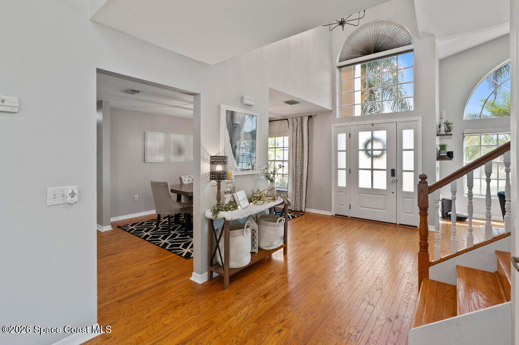2639 Lowell Circle Melbourne, FL 32935 - Photo 4 of 45 a view of livingroom with furniture and wooden floor