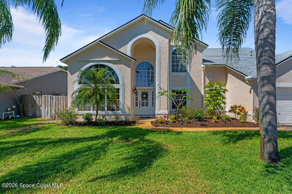 2639 Lowell Circle Melbourne, FL 32935 - Photo 45 of 45 a front view of house with yard and green space