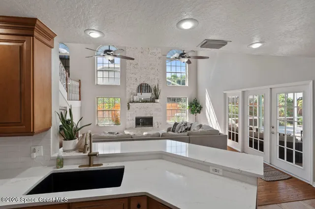a kitchen with a sink and a refrigerator