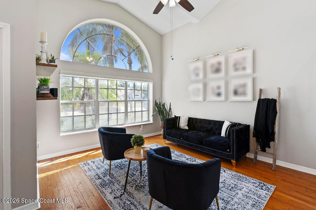 2639 Lowell Circle Melbourne, FL 32935 - Photo 6 of 45 a living room with furniture and a window