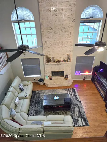 view of living room with furniture and a fireplace