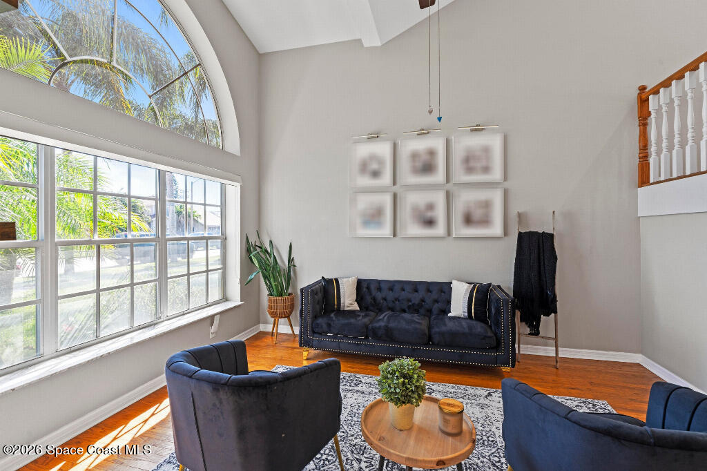 2639 Lowell Circle Melbourne, FL 32935 - Photo 7 of 45 a living room with furniture and a potted plant