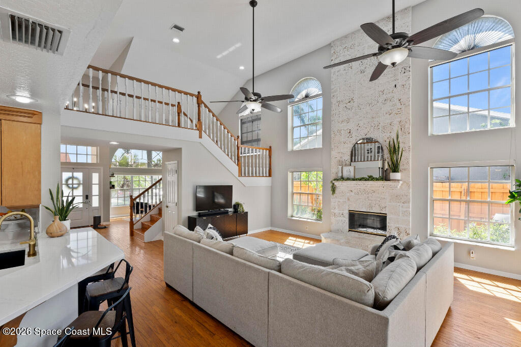 2639 Lowell Circle Melbourne, FL 32935 - Photo 9 of 45 a living room with furniture fireplace and flat screen tv