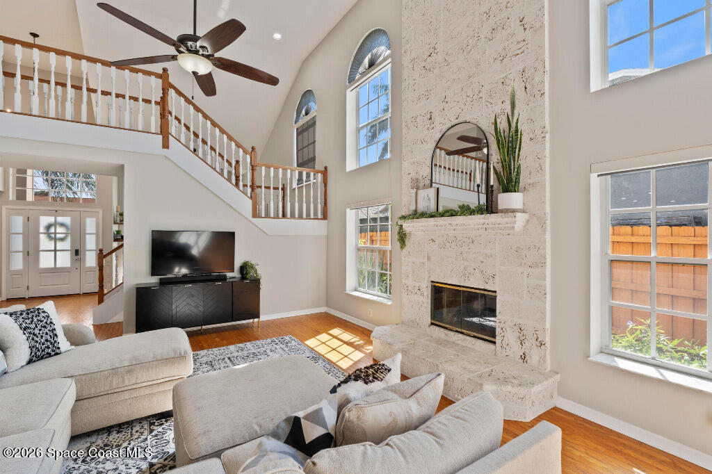 2639 Lowell Circle Melbourne, FL 32935 - Photo 10 of 45 a living room with furniture fireplace and a window
