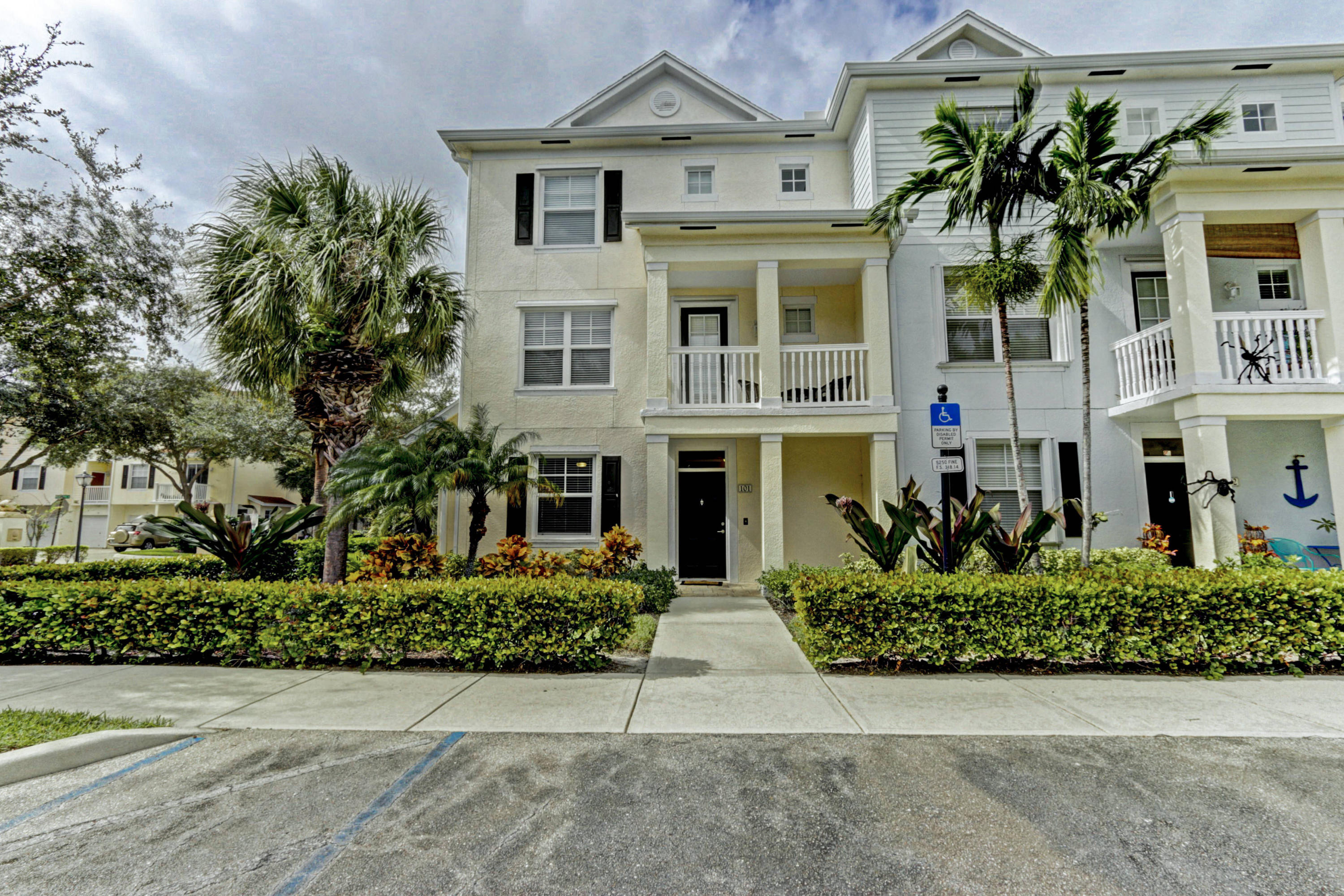 a front view of a residential houses with yard