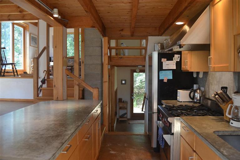 340 Coles Neck Road Wellfleet, MA 02667 - Photo 3 of 27 a kitchen with stainless steel appliances granite countertop a stove a sink and a refrigerator
