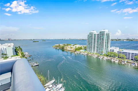 a kitchen with stainless steel appliances granite countertop a stove and a refrigerator