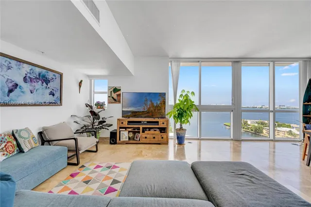 a room with furniture and a flat screen tv