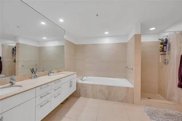 a bedroom with a large bed and a large window