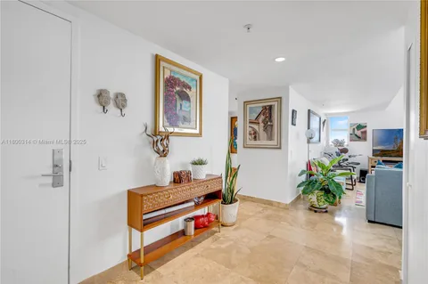 a bedroom with a bed and a flat tv screen