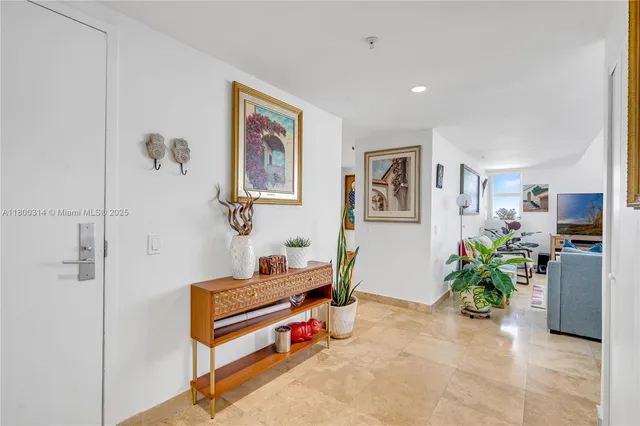 a bedroom with a bed and a flat tv screen