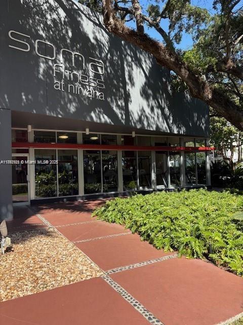 650 Northeast 64th Street, Unit G608 Miami, FL 33138 - Photo 18 of 31 a view of a house with a yard and potted plants
