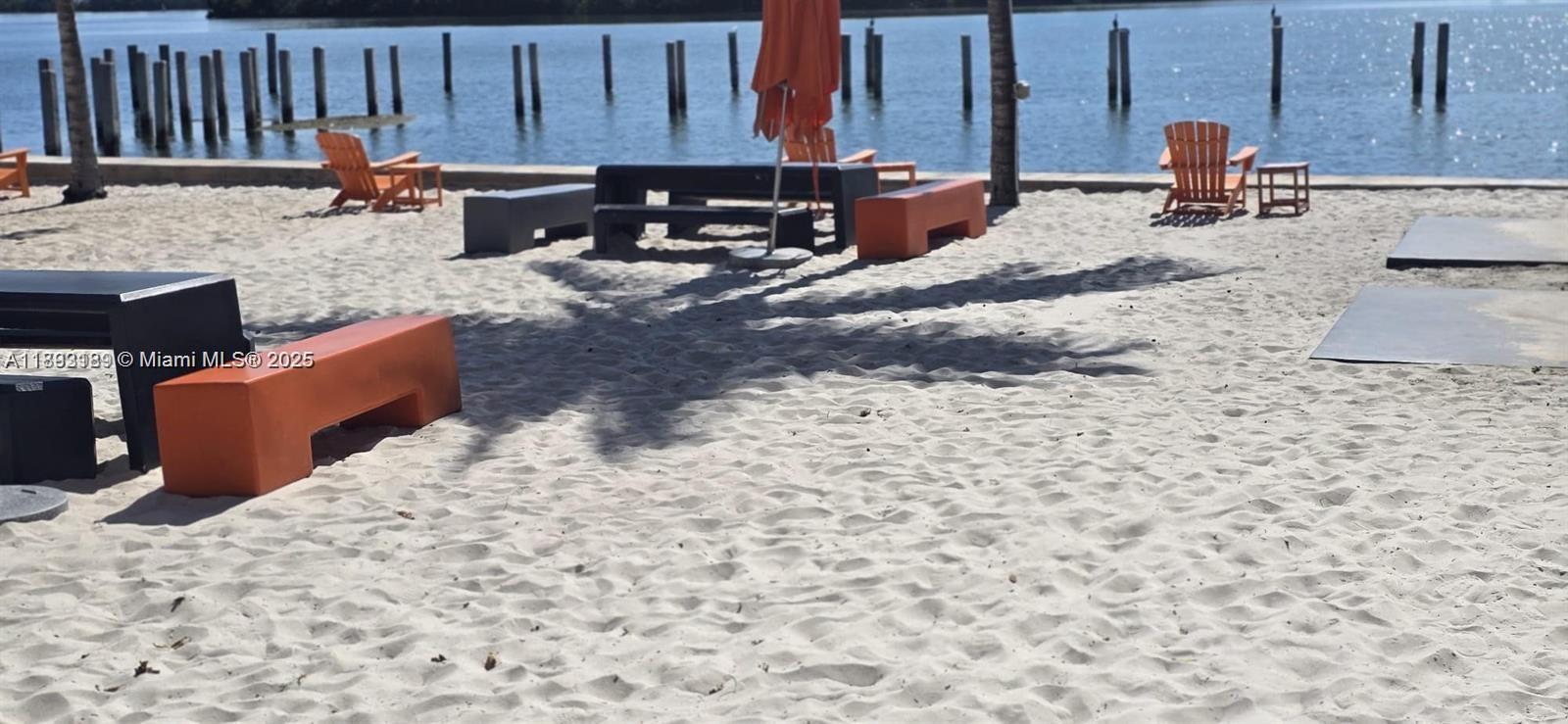 650 Northeast 64th Street, Unit G608 Miami, FL 33138 - Photo 2 of 31 a backyard of a house with barbeque oven