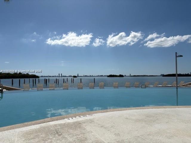 650 Northeast 64th Street, Unit G608 Miami, FL 33138 - Photo 22 of 31 a view of a lake with couches in the room