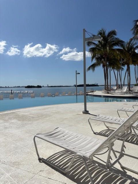 650 Northeast 64th Street, Unit G608 Miami, FL 33138 - Photo 23 of 31 a view of a swimming pool and an outdoor seating