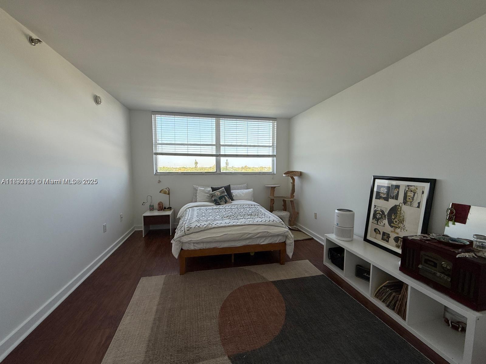 650 Northeast 64th Street, Unit G608 Miami, FL 33138 - Photo 3 of 31 a bedroom with a bed and window
