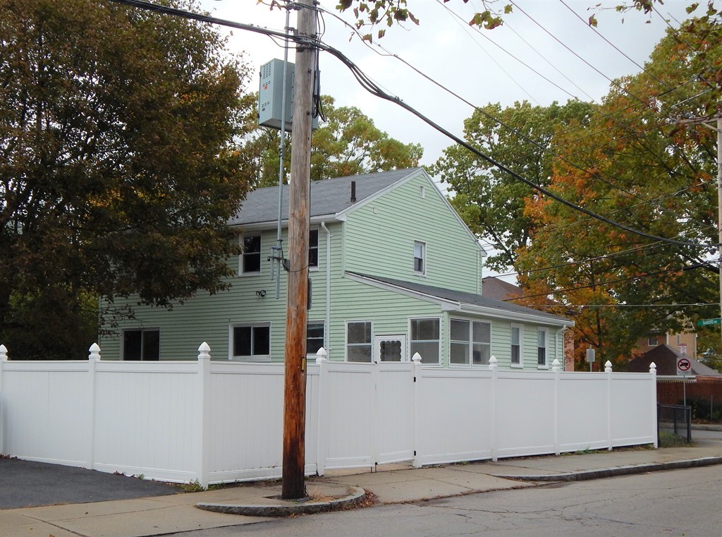 115 Desoto Road Boston, MA 02132 - Photo 2 of 21 a front view of a house with a yard
