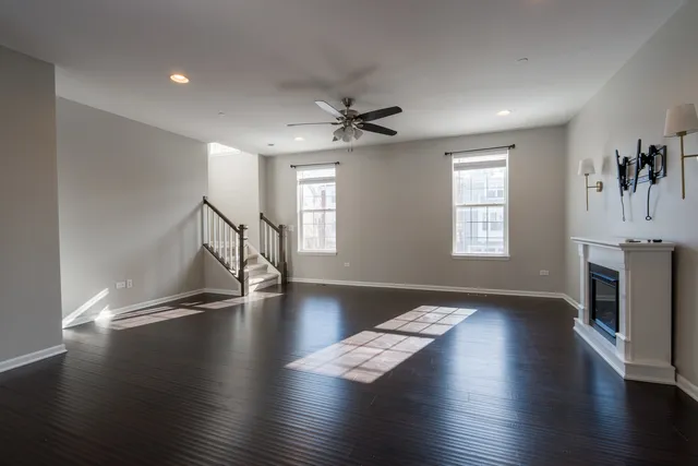 a view of a living room and dining room with wooden floor