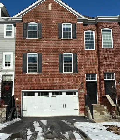 a kitchen with stainless steel appliances granite countertop a refrigerator oven a sink dishwasher and a stove with wooden floor