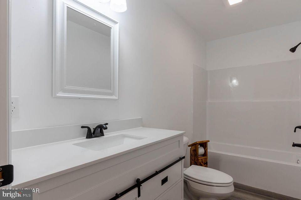 310-312 West Clinton Street Lock Haven, PA 17745 - Photo 12 of 30 a bathroom with a sink a toilet and shower