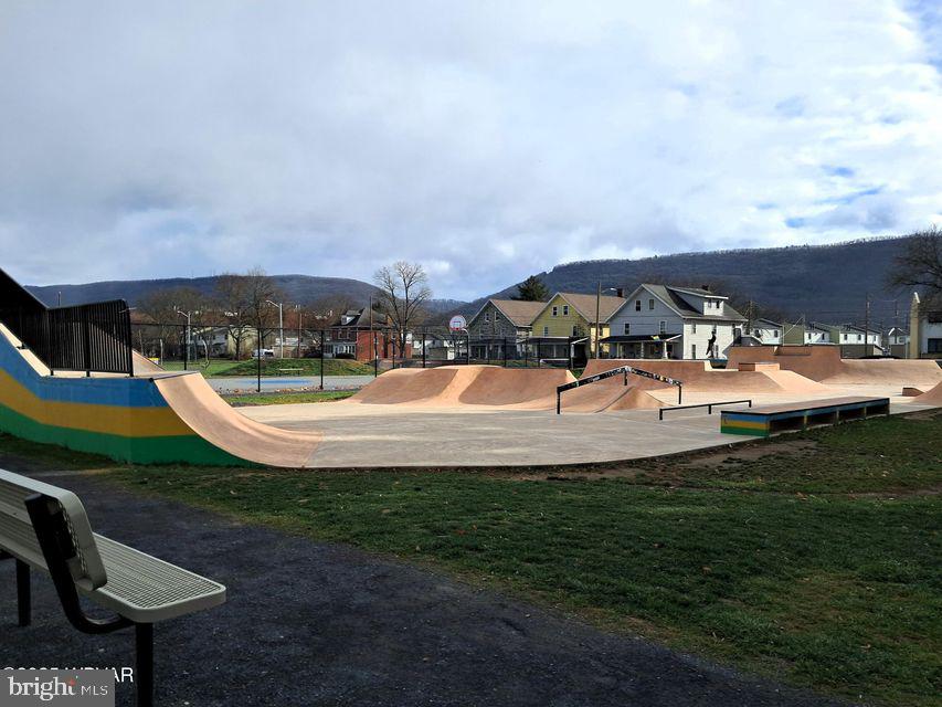 310-312 West Clinton Street Lock Haven, PA 17745 - Photo 29 of 30 a view of a swimming pool with lawn chairs under an umbrella