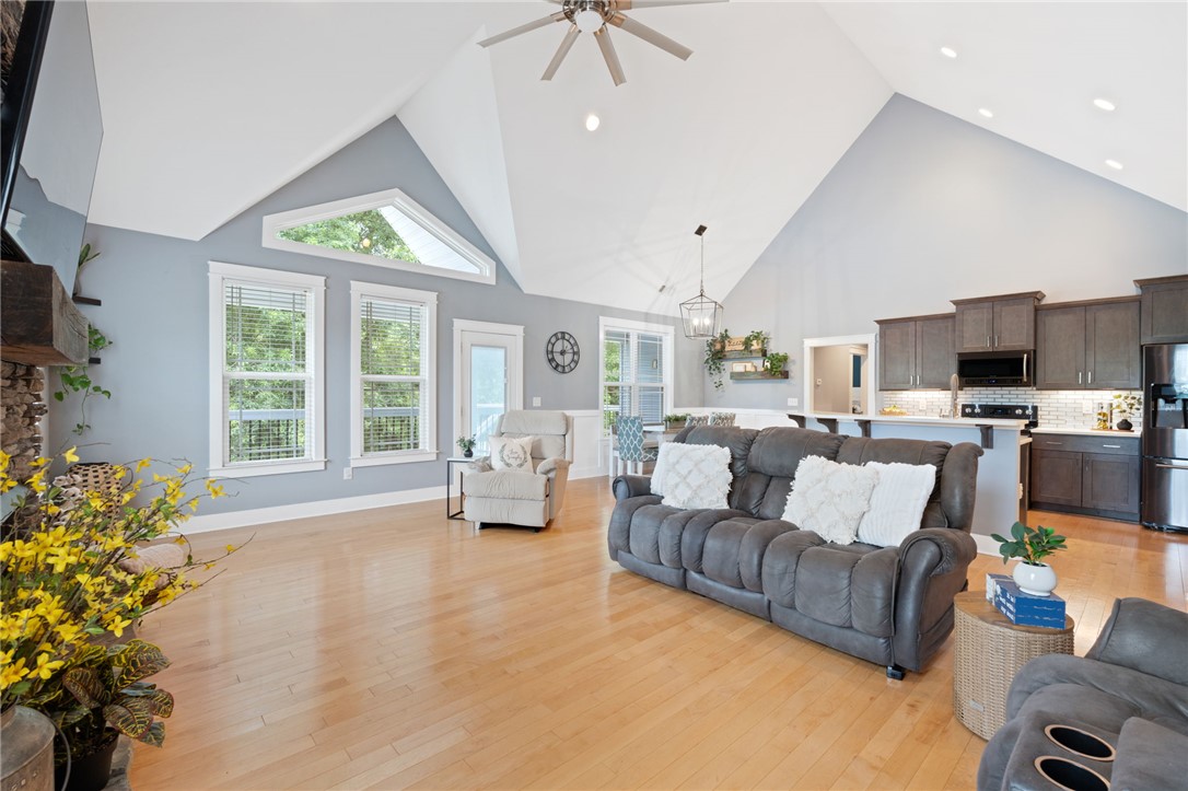 1050 Old Dacusville Road Easley, SC 29640 - Photo 7 of 33 This living area features soaring vaulted ceilings and rich hardwood flooring, creating an expansive and inviting atmosphere.