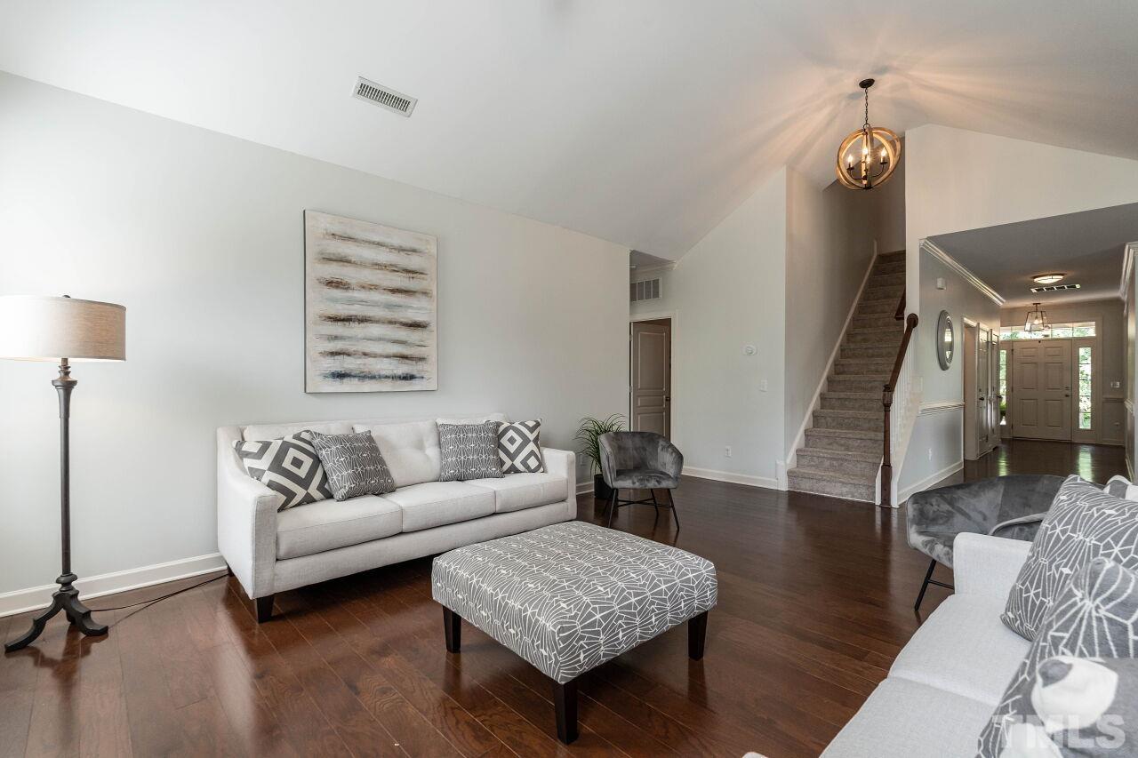928 Palace Garden Way Raleigh, NC 27603 - Photo 11 of 40 a living room with furniture and wooden floor