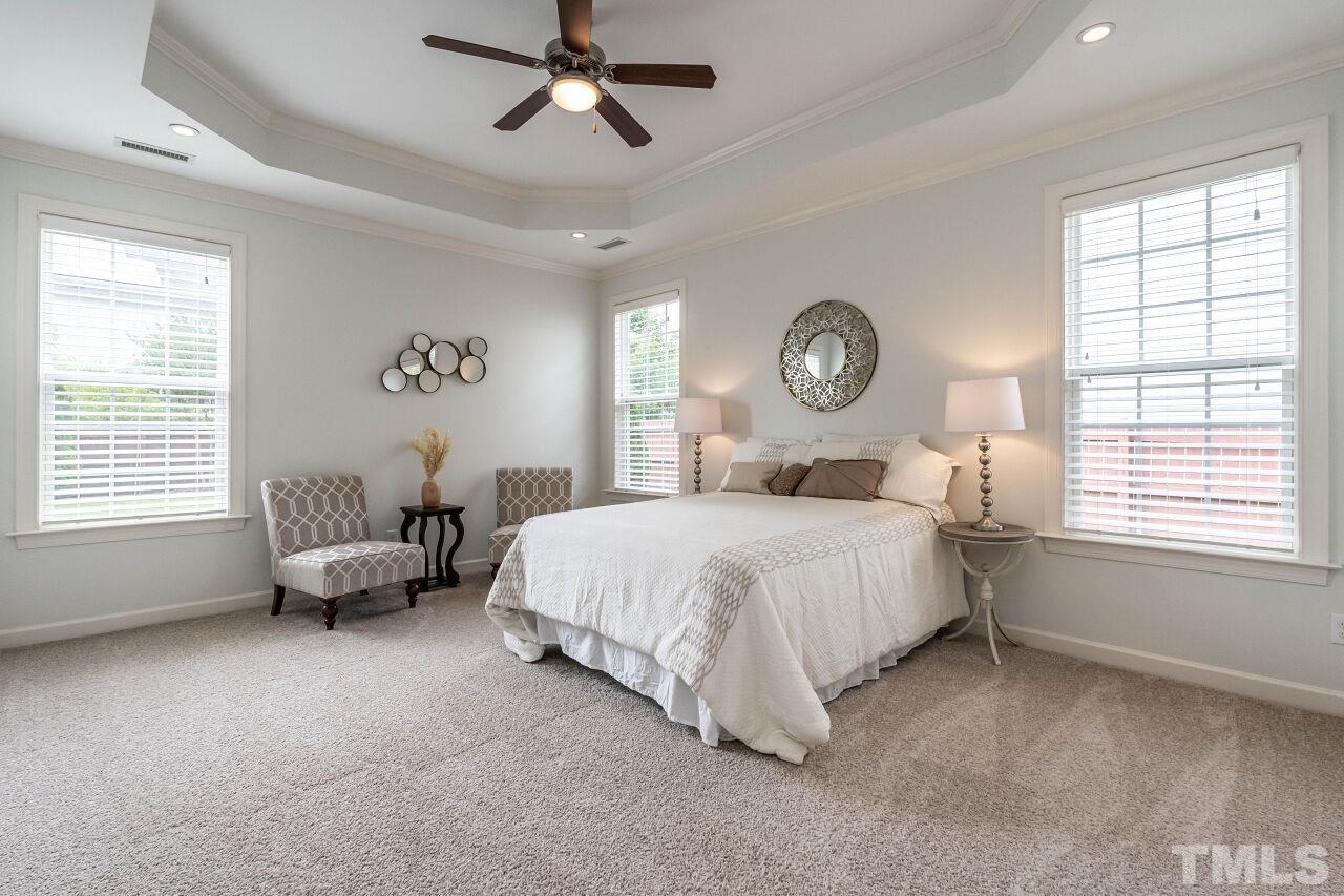 928 Palace Garden Way Raleigh, NC 27603 - Photo 19 of 40 a bedroom with a bed and a window
