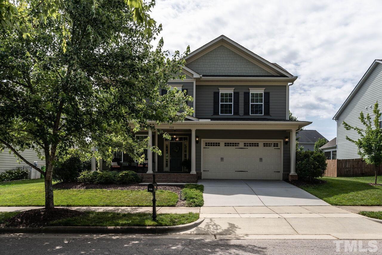 928 Palace Garden Way Raleigh, NC 27603 - Photo 2 of 40 a front view of a house with a garden