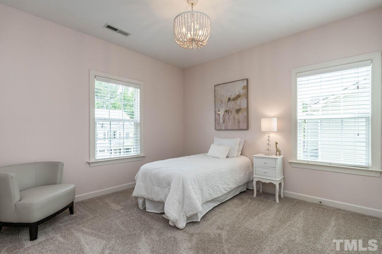 928 Palace Garden Way Raleigh, NC 27603 - Photo 27 of 40 a bedroom with a bed furniture and a window