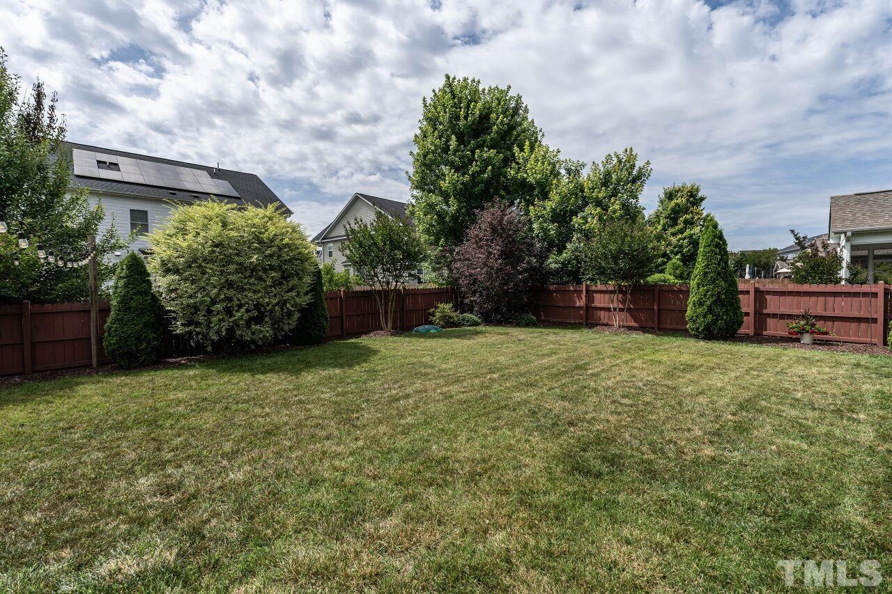 928 Palace Garden Way Raleigh, NC 27603 - Photo 34 of 40 a backyard of a house with lots of green space