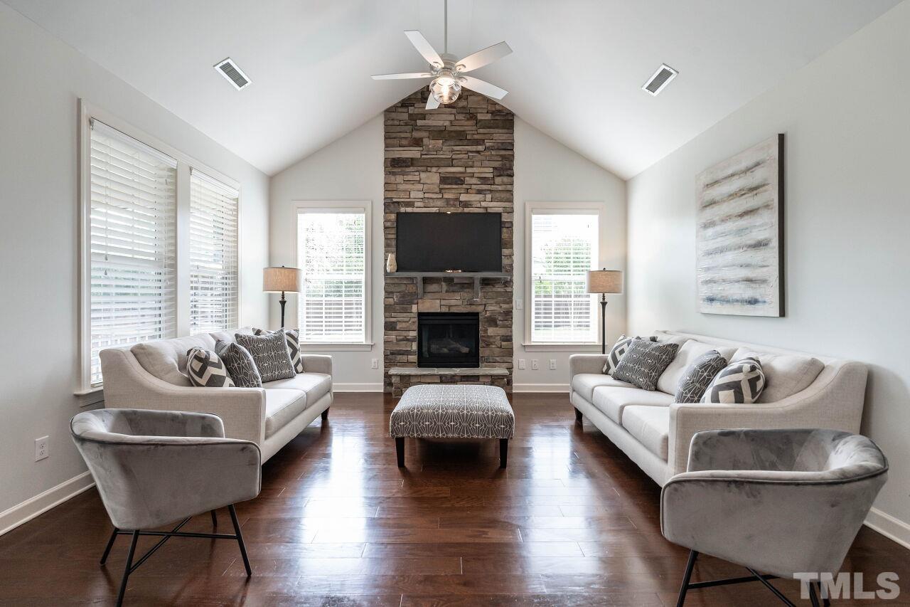 928 Palace Garden Way Raleigh, NC 27603 - Photo 8 of 40 a living room with furniture and a fireplace