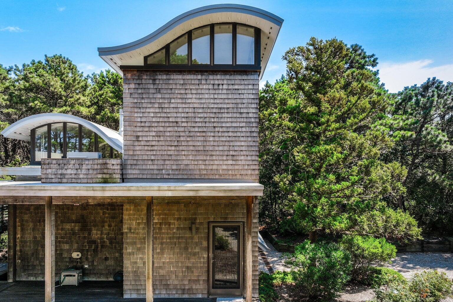 195 King Phillip Road Wellfleet, MA 02667 - Photo 11 of 62 a front view of a house with a yard
