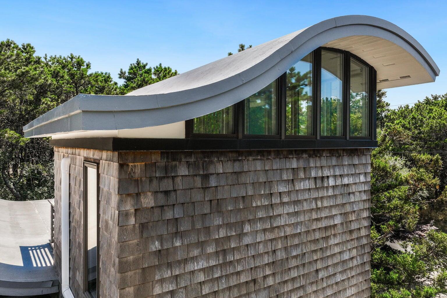 195 King Phillip Road Wellfleet, MA 02667 - Photo 13 of 62 a front view of a house with garden