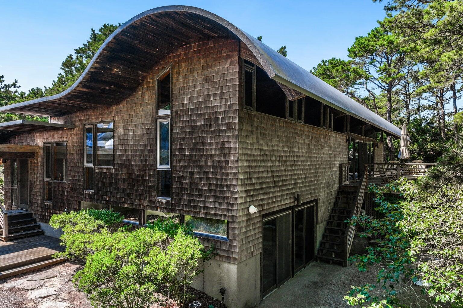 195 King Phillip Road Wellfleet, MA 02667 - Photo 4 of 62 a backyard of a house with lots of green space