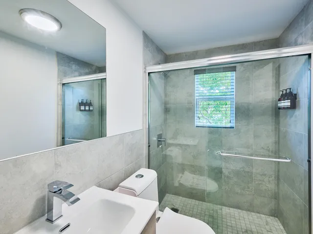 a bathroom with a sink and mirror