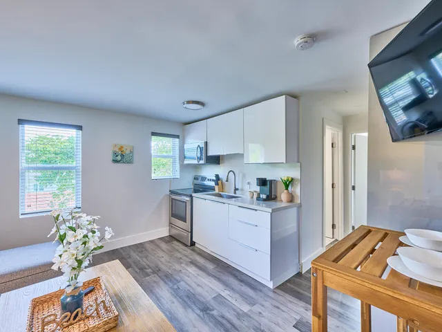 a kitchen with furniture and window