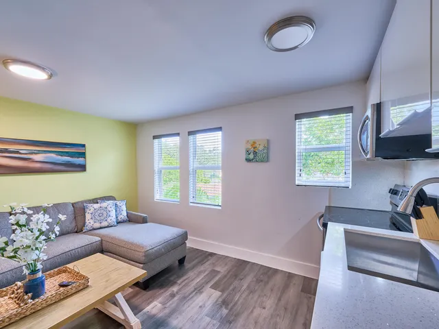 a living room with furniture and a window